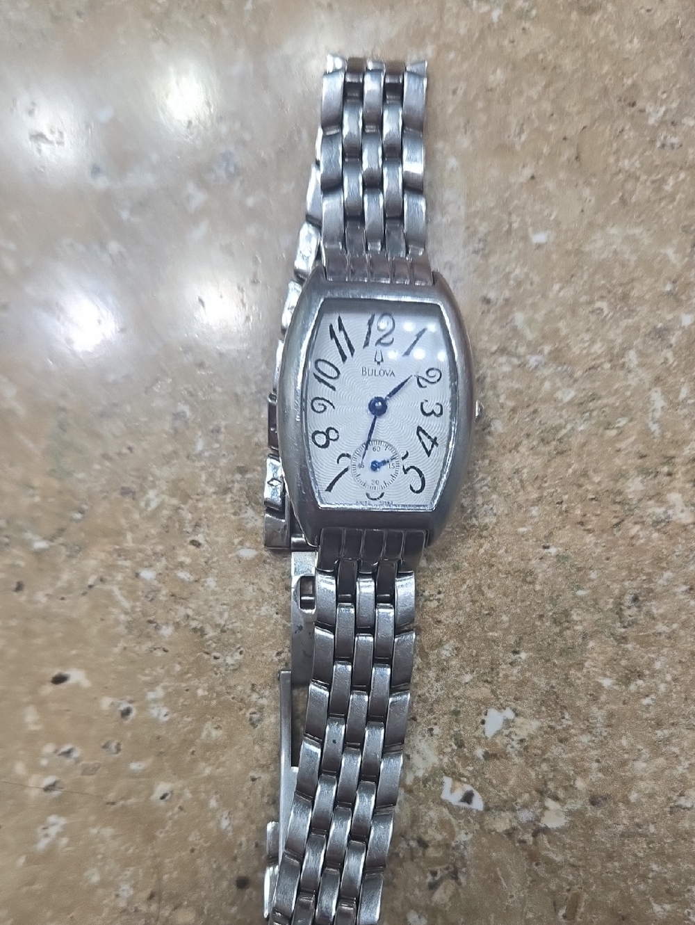 Bulova Silver Watch with White Dial and Blue Hands